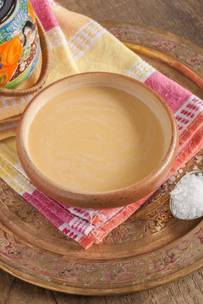 yak butter tea in a bowl on a colorful towel