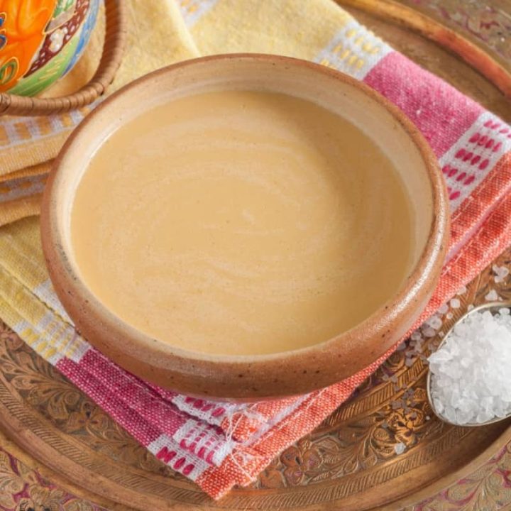 yak butter tea in a bowl on a colorful towel