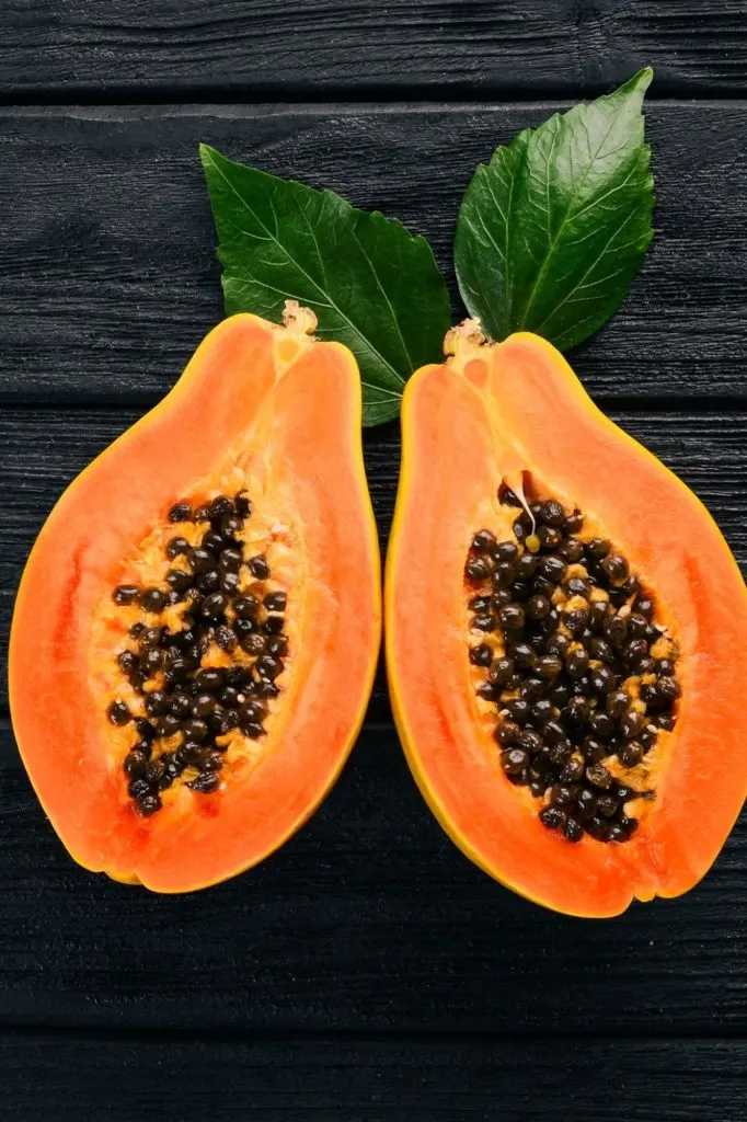 panera copycat iced papaya green tea fruit on a dark background